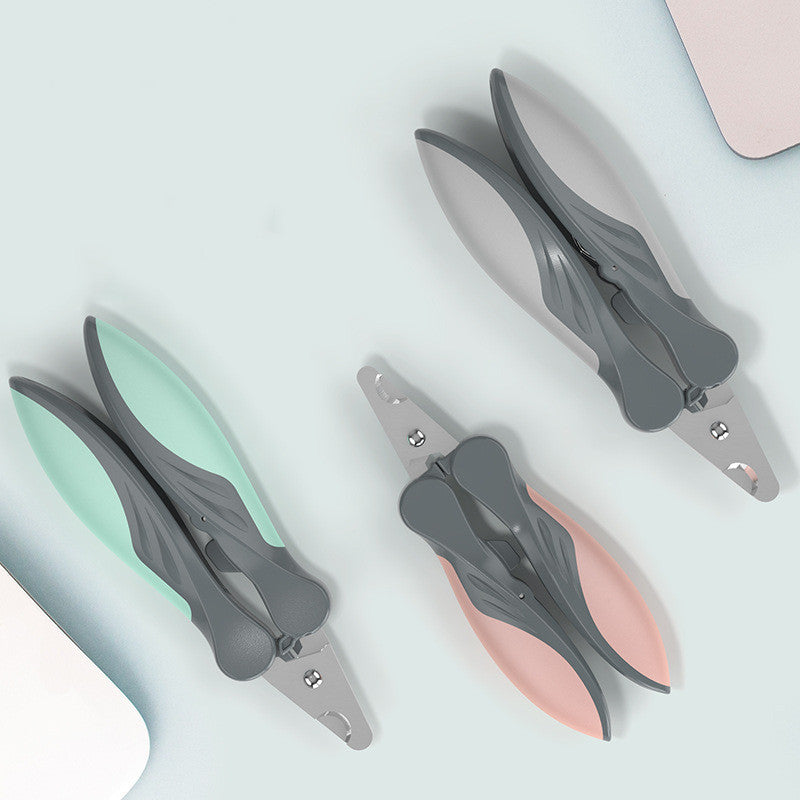 Three pairs of nail clippers arranged diagonally on a pale blue background. Each pair has gray metal blades and handles with different handle colors: mint green, light pink, and light gray.