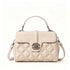 A structured top-handle handbag in light beige quilted leather with a silver-tone interlocking G logo on the front flap, shown on a clean white background.