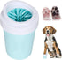 Pet toothbrush holder with cleaning brush, dog paws, and a dog sitting next to it.