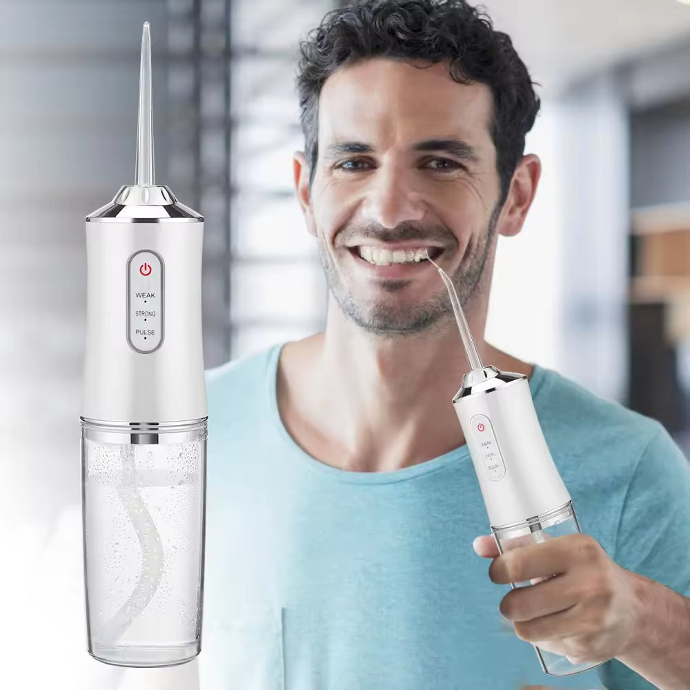 Man using a dental water flosser with a clear background