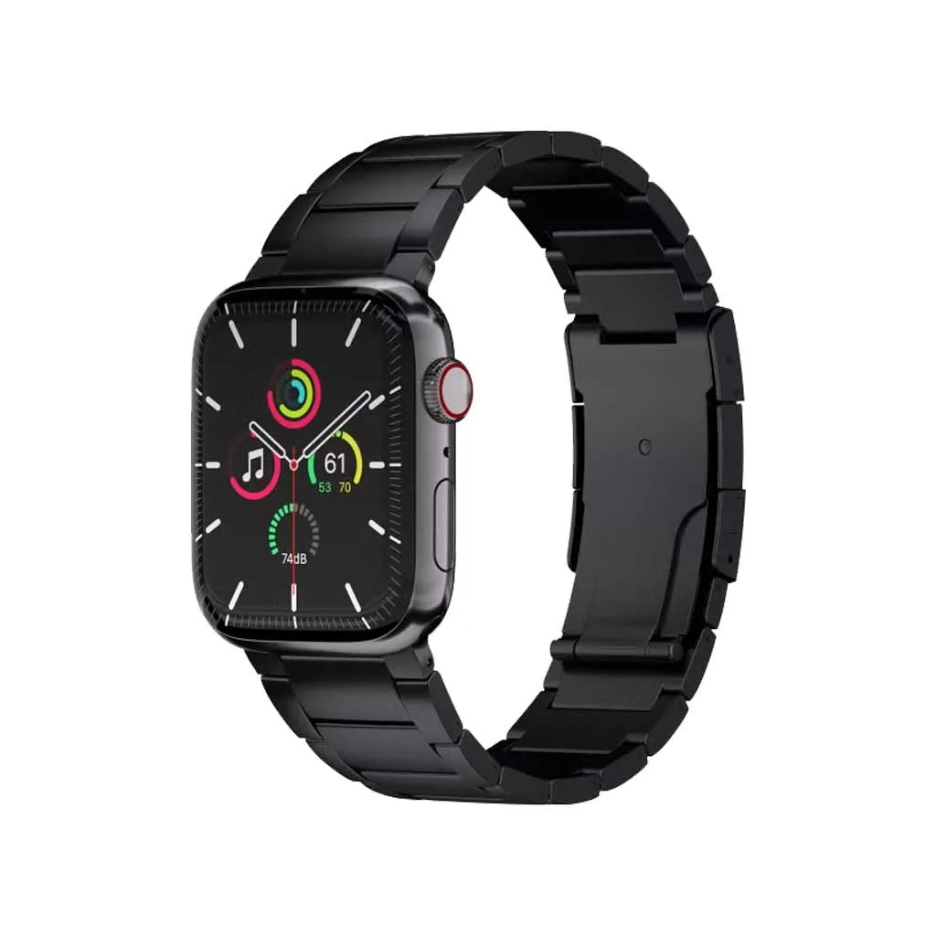 A black smartwatch with a rectangular black metal link band, shown on a plain white background. The watch face displays colorful digital watch faces.