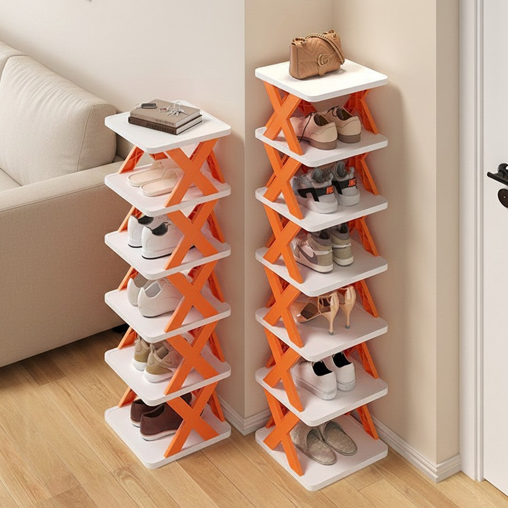 Two compact white and orange shoe racks standing in a hallway corner next to a sofa, with multiple pairs of shoes displayed on the shelves.