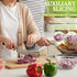 A person using a vegetable slicer with a knife on a cutting board, slicing a red onion. The scene includes promotional text reading &