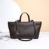 A dark brown textured leather tote bag with double top handles and a long shoulder strap, displayed on a white surface against a beige and white background.