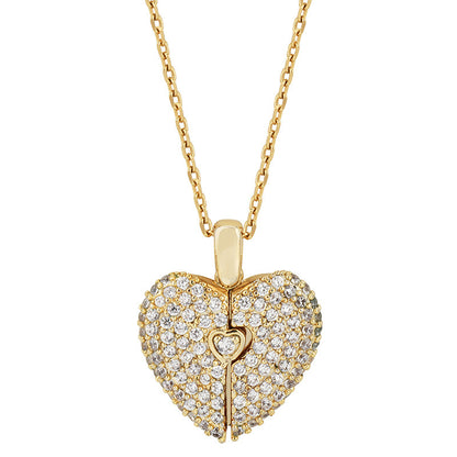 A gold heart-shaped pendant necklace paved with clear stones, featuring a small keyhole detail in the center, shown on a white background.